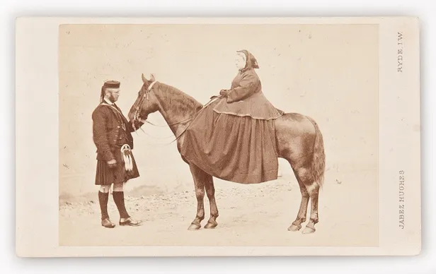 Carte de Visite featuring Queen Victoria seated on her pony Flora, with her personal servant John Brown attending.