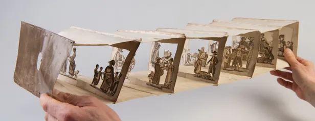 Handmade peep show formed from a copy of The New Cries of London.