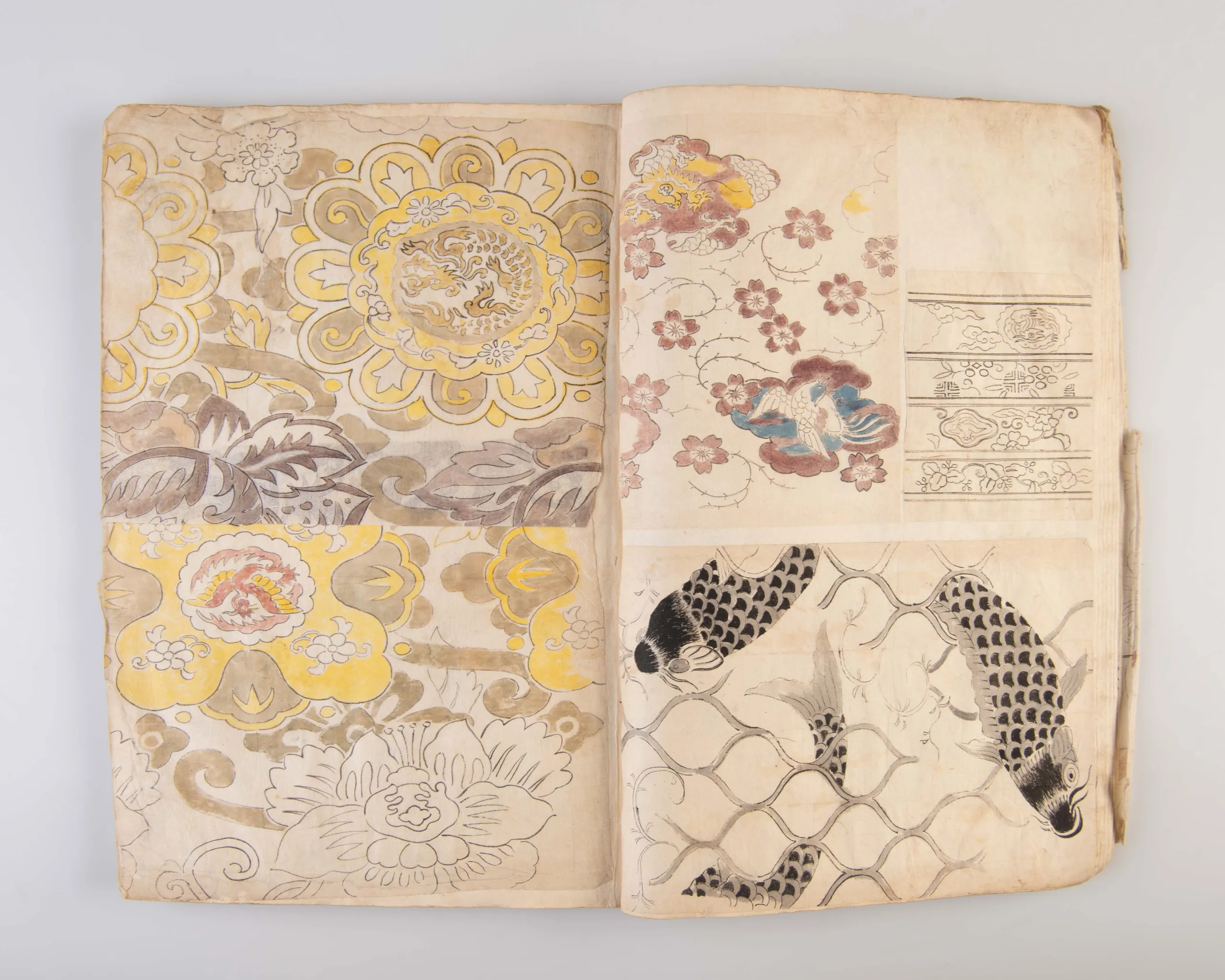 A collection of three weaving pattern scrapbooks, including Orimono kodai zu [Album of antique woven textile designs]