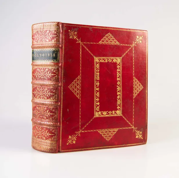 (King James Version). The Holy Bible. Contemporary red morocco, panelled in gilt. Cambridge: John Archdeacon, 1768.