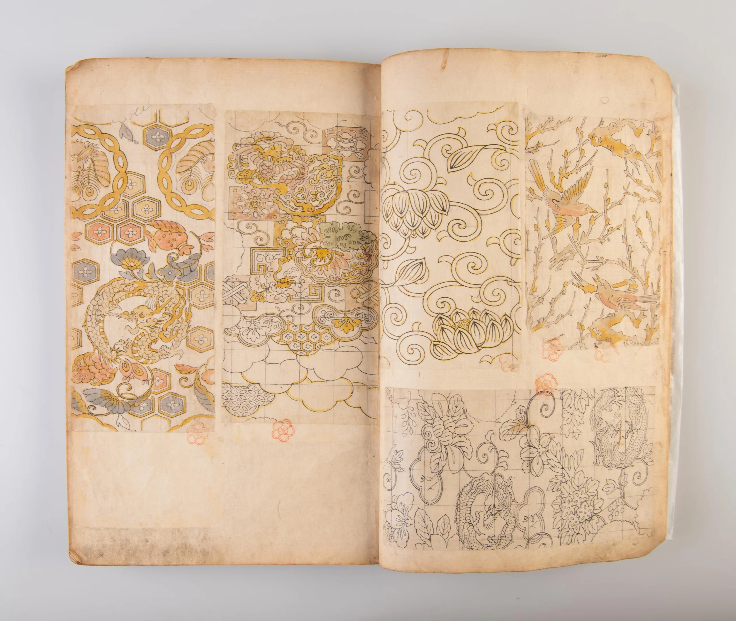 A collection of three weaving pattern scrapbooks, including Orimono kodai zu [Album of antique woven textile designs]