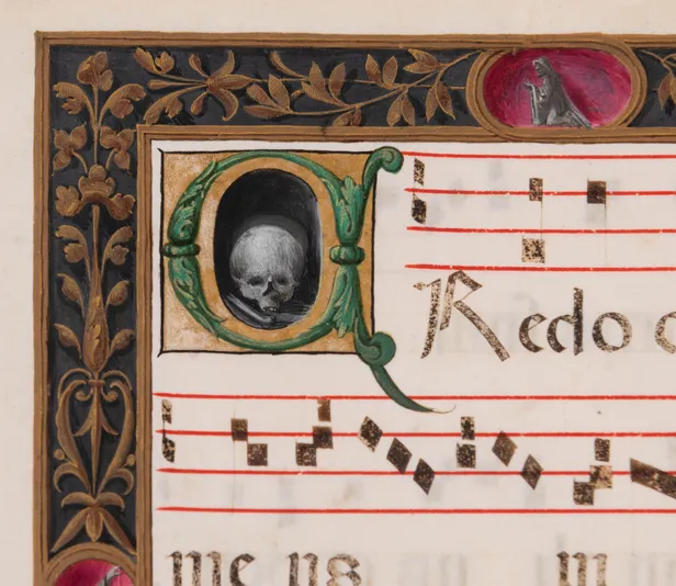 Processional leaf with historiated initial C containing skull & bone, illuminated manuscript on vellum.