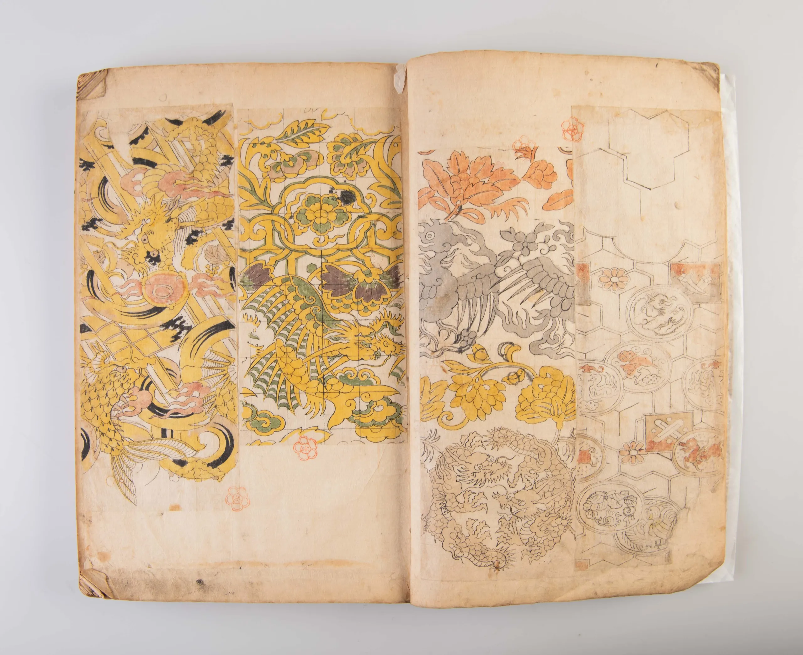 A collection of three weaving pattern scrapbooks, including Orimono kodai zu [Album of antique woven textile designs]