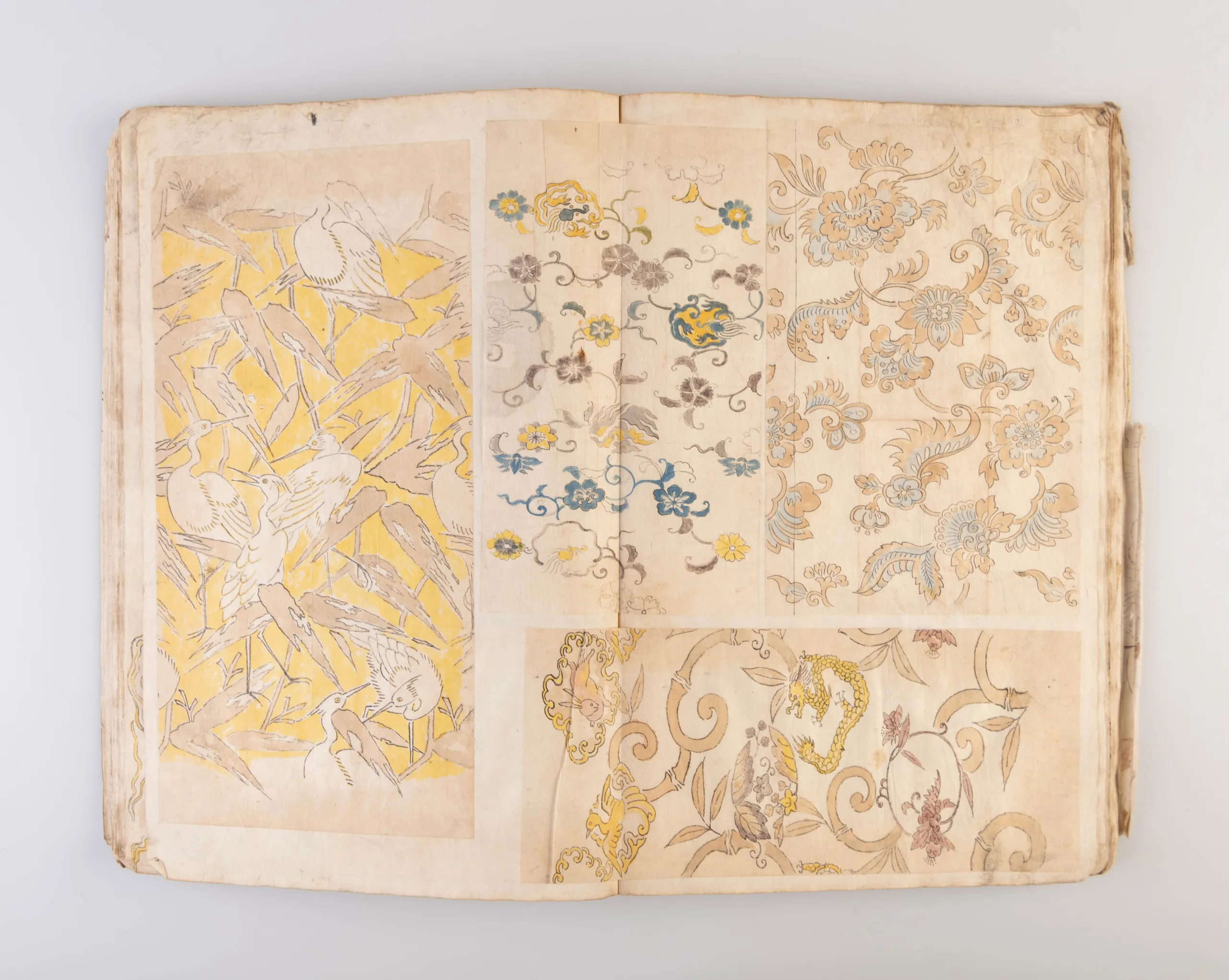 A collection of three weaving pattern scrapbooks, including Orimono kodai zu [Album of antique woven textile designs]